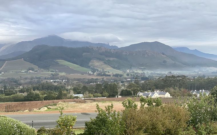 The Franschhoek valley, vineyards and wine estates ringed by mountains